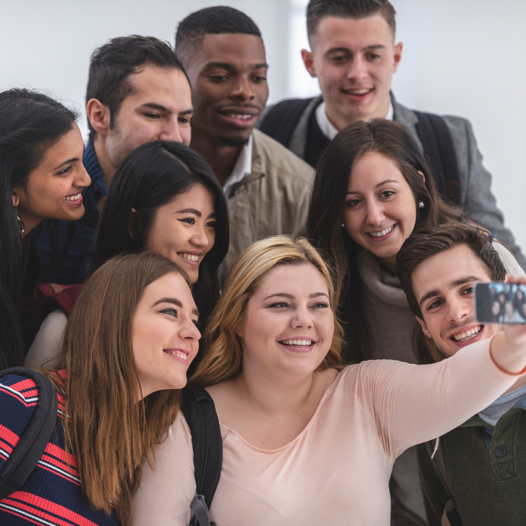 group of school friends taking selfie